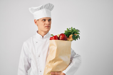 a man in a chef's uniform a package of products work service