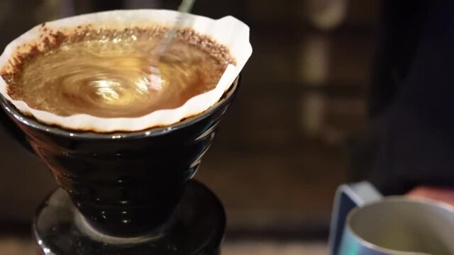 Tangerang. Indonesia - February 2021. stiring cofee at coffee shop