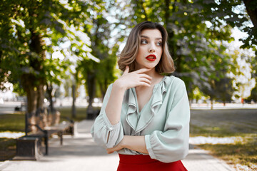 cheerful woman walking in the park trees leisure lifestyle