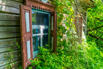 Windows of an abandoned house inside the Chernobyl Exclusion Zone near the town of Chernobyl, Ukraine
