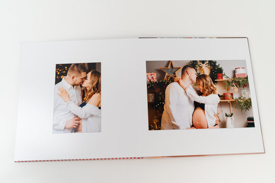 page photobook from photo shoot of couple during pregnancy in new year's kitchen