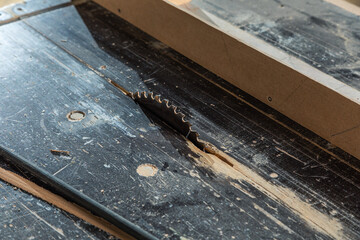 A carpenter works on woodworking the machine tool. Carpenter working on woodworking machines in carpentry shop.