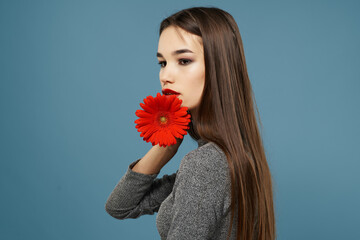 brunette with red flower bright makeup glamor romance close-up