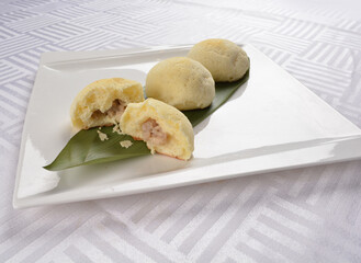 baked crispy skin bolo bun bread with stir fried chicken and mushroom inside Hong Kong dim sum menu