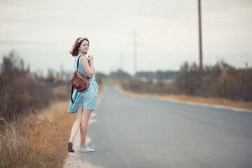 Young girl on a walk in the autumn