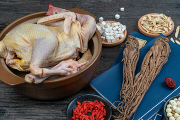 Fresh hens and Chinese herbs on the table.