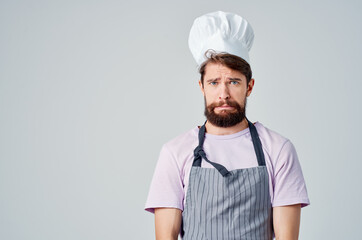 man in chef's uniform emotions hand gestures professional light background