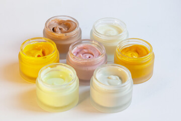 Cream in a jar on a white background