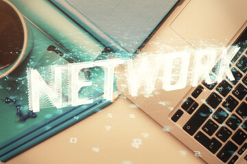 Multi exposure of data drawing hologram over topview of study desk background with computer. Concept of technology.