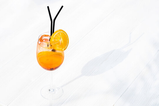 cocktail aperol spritz on a white background. traditional Italian alkoholic refreshing drink