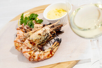 grilled prawns with a glass of white wine