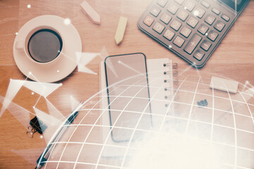 Double exposure of map hologram drawing over desktop. Top view. International connection concept.
