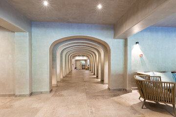 Interior of a long corridor with arches