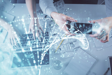 Double exposure of man and woman working together and DNA hologram drawing. Computer background. Medical education concept. Top View.