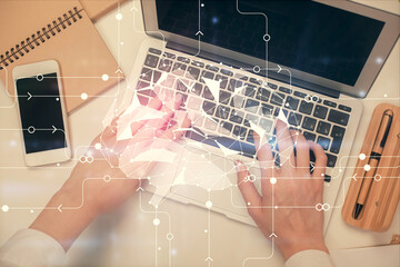 Double exposure of woman working on computer andhuman brain hologram drawing. Top View. Ai concept.