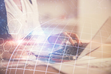 Double exposure of woman hands working on computer and world map hologram drawing. International technology business concept.