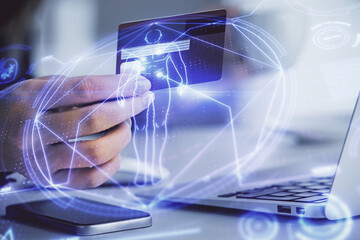 Multi exposure of woman on-line shopping holding a credit card and education theme drawing....