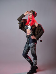 carnival queen. A young woman with bright pink hair in a Mardi Gras costume,