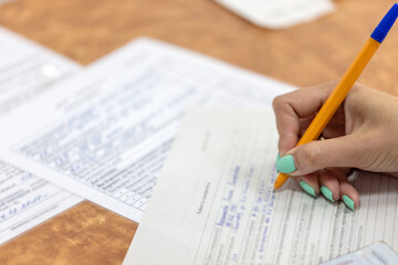 Questionnaire Application Form Vaccination Medical Clinic Hand Write Pen Tick Paper Document Sample Fill Table Closeup Contract Office Survey Business Education Voting Taking Decision Deal