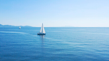 Aerial view of sailing luxury yacht at opened sea at sunny day in Croatia