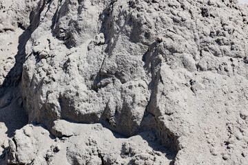 A bunch of gray sand close-up. building material. background.
