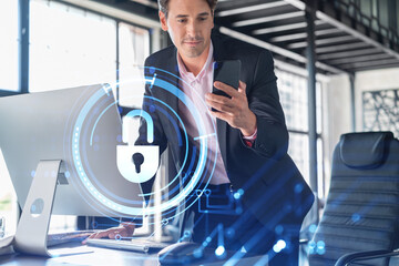 Businessman in suit checking cyber security using smart phone to protect clients confidential information. IT hologram lock icons over modern panoramic office background.