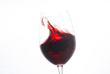 red wine pouring into glass. Red wine. Alcohol. Wine. Photo. Background. Drops. 