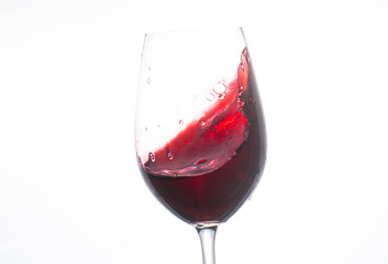 red wine pouring into glass. Red wine. Glass. Background. 