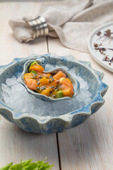 salmon ceviche with avacado and passionfruit sauce
