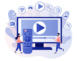 Fototapeta premium Smart TV and remote control. Tiny people watch video, content, applications on multimedia box tv. Modern television technology. Modern flat cartoon style. Vector illustration on white background