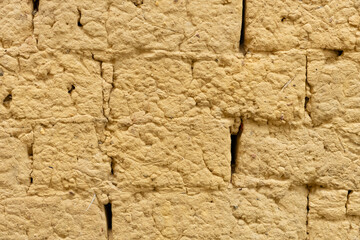 wall made of mud bricks as background and texture