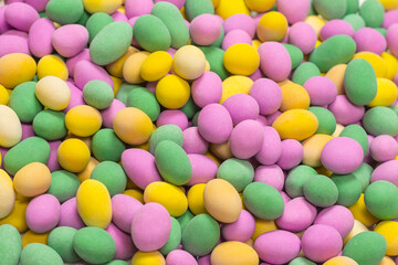 Group of colorful peanuts in glaze.