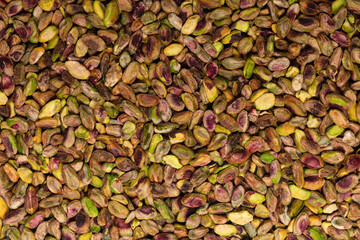 Peeled tasty pistachios as a background.