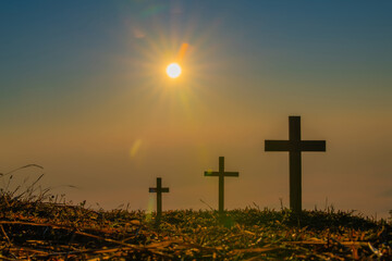 The crucifixion of Jesus Christ at the sunrise - Silhouette Three Crosses On Hill