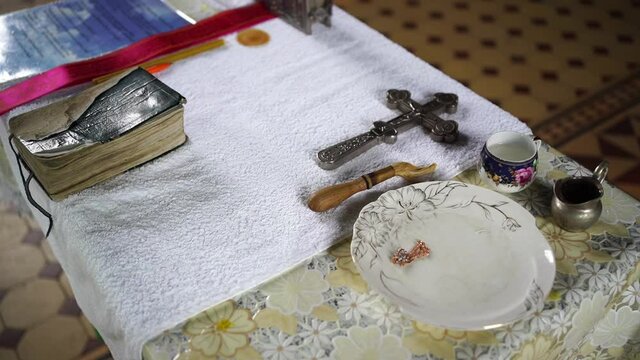 items for the baptism of a child in the Orthodox Church on the table.