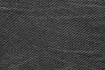 texture of worn black denim for empty background or for desktop wallpaper