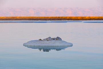 Sunset at the Dead Sea. Salt formations. Mountain range