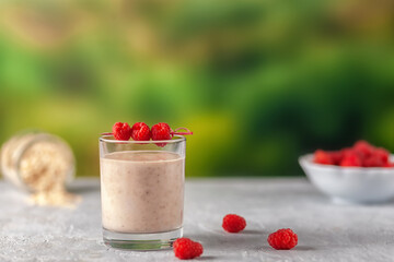 Healthy dietary food. Oatmeal milkshake with bananas and raspberries.