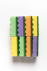 colored washcloths for washing dishes on a white background, top view