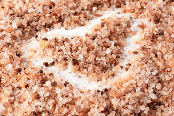 Himalayan pink salt on white background, drawn heart, love