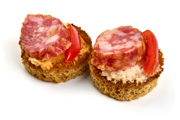 Bruschetta with fuet sausage, isolated on white background. High resolution image.
