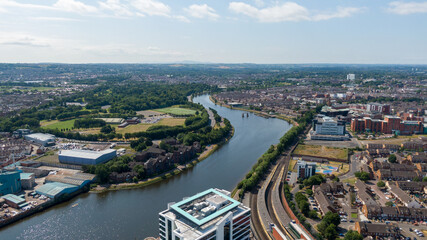 Aerial view on river and buildings in City center of Belfast Northern Ireland. Drone photo, high angle view of town