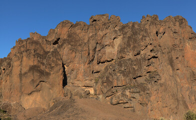 Fototapeta premium Gran Canaria, landscape of the central part of the island, Las Cumbres, ie The Summits, short hike between rock Formation Chimirique and iconic Roque Nublo, evening light