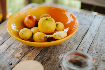 bowl of lemon, apple and banana