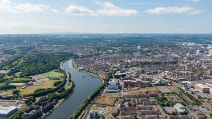 Obraz premium Aerial view on river and buildings in City center of Belfast Northern Ireland. Drone photo, high angle view of town