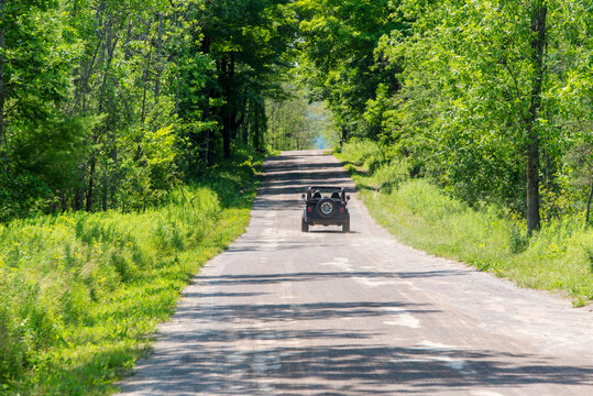Four-wheeler ride on a small road in the forest