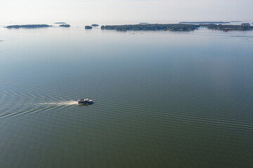 photo from a drone on a sunny morning Gulf of Finland and a sailing boat.
