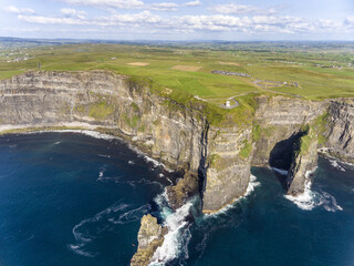 World famous Cliffs of Moher. Popular tourist destination in Ireland. Aerial birds eye view attraction on Wild Atlantic Way in County Clare. - 445875891