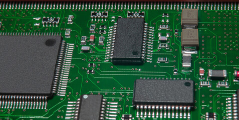 printed circuit board with active and passive surface mounted components close up