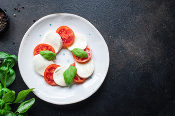 caprese salad mozzarella cheese, tomato basil leaf italian snack copy space food background rustic. top view